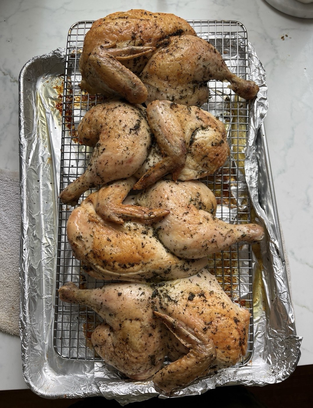 Herb-roasted chicken pieces fresh out of the oven